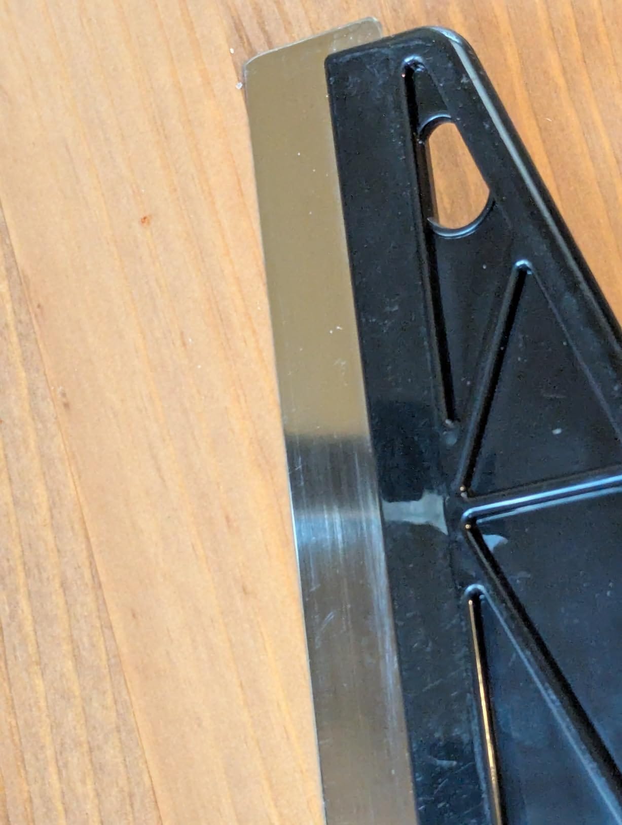 Paint Edger gliding along wood trim