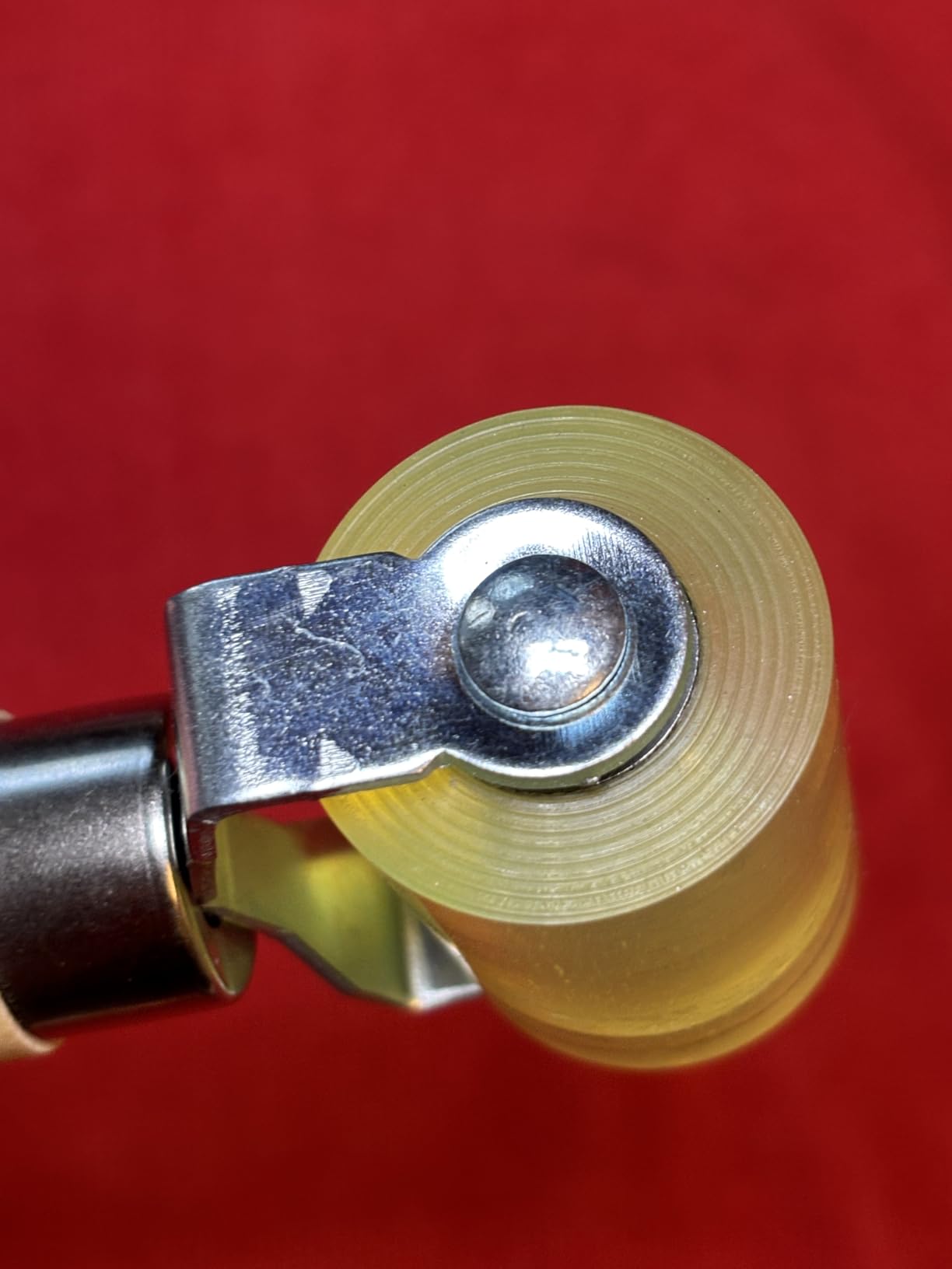 Seam roller in action on car door panel