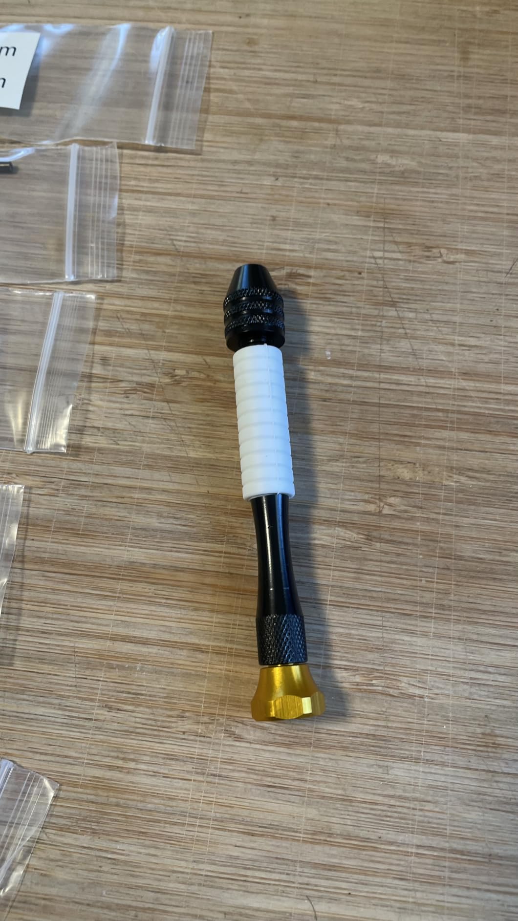 Small drill bits arranged for controlled hand drilling